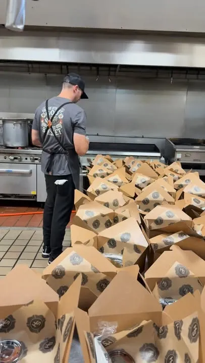 Hundreds of Station House BBQ box lunches packed in the kitchen